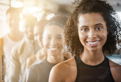 Fitness, black woman and portrait with team, workout class and training in a health and wellness club. Lens flare, happy and smile with diversity and personal trainer with exercise, sports and group