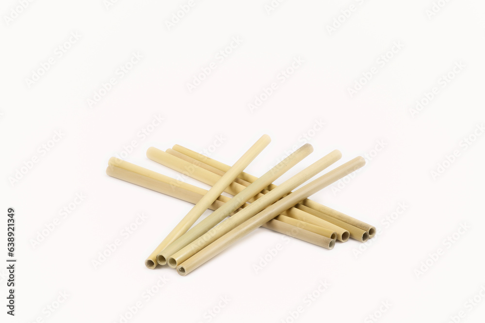 Eco-friendly bamboo drinking straws, a sustainable alternative to plastic, showcased against a clean white background. 'no to plastic' concept, offering copy space for your message. Eco-friendly bamboo drinking straws, a sustainable alternative to plastic, showcased against a clean white background. 'no to plastic' concept, offering copy space for your message.