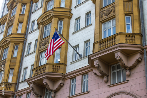 MOSCOW, RUSSIA - AUGUST, 28, 2023: The American flag flies on the wall of the embassy building in the historic building photo