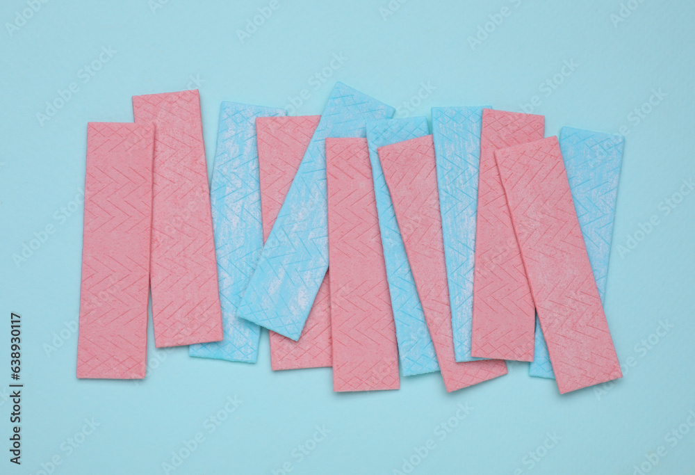 Many sticks of tasty chewing gum on turquoise background, flat lay Many sticks of tasty chewing gum on turquoise background, flat lay