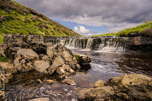 This is the stream above Hull Pot near Pen-y-Ghent in ribblesdale in the Yorkshire Dales. Here it flows over a rock shelf creating a mini waterfall. photo