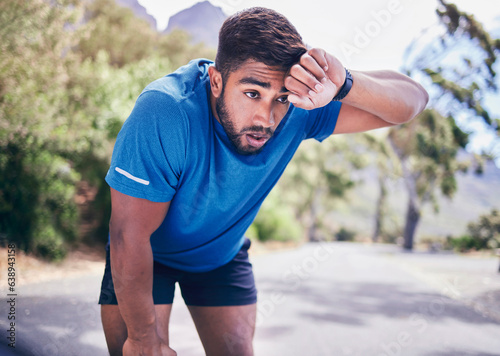 Obraz na plátně Man, tired and sweating for sports training, exercise break and workout challenge in nature park