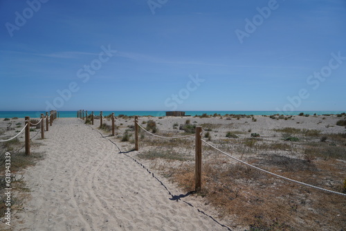 Path to the Mediterranean beach with sunshine and sky