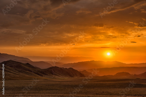 Dawn of the sun in the Dzungarian Alatau in the southeastern part of Kazakhstan
