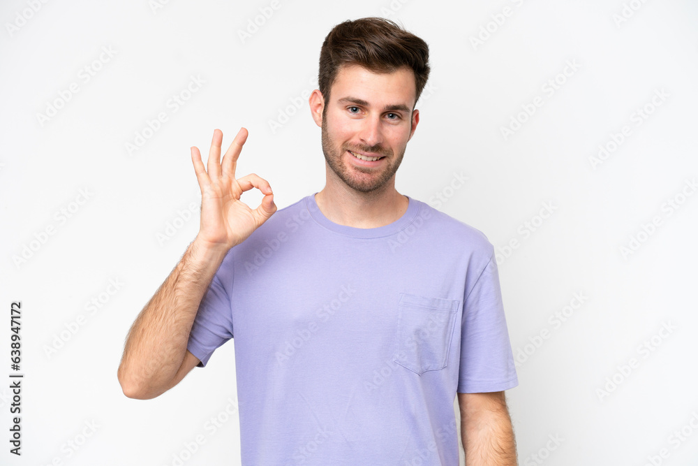 Young caucasian man isolated on white background showing ok sign with fingers