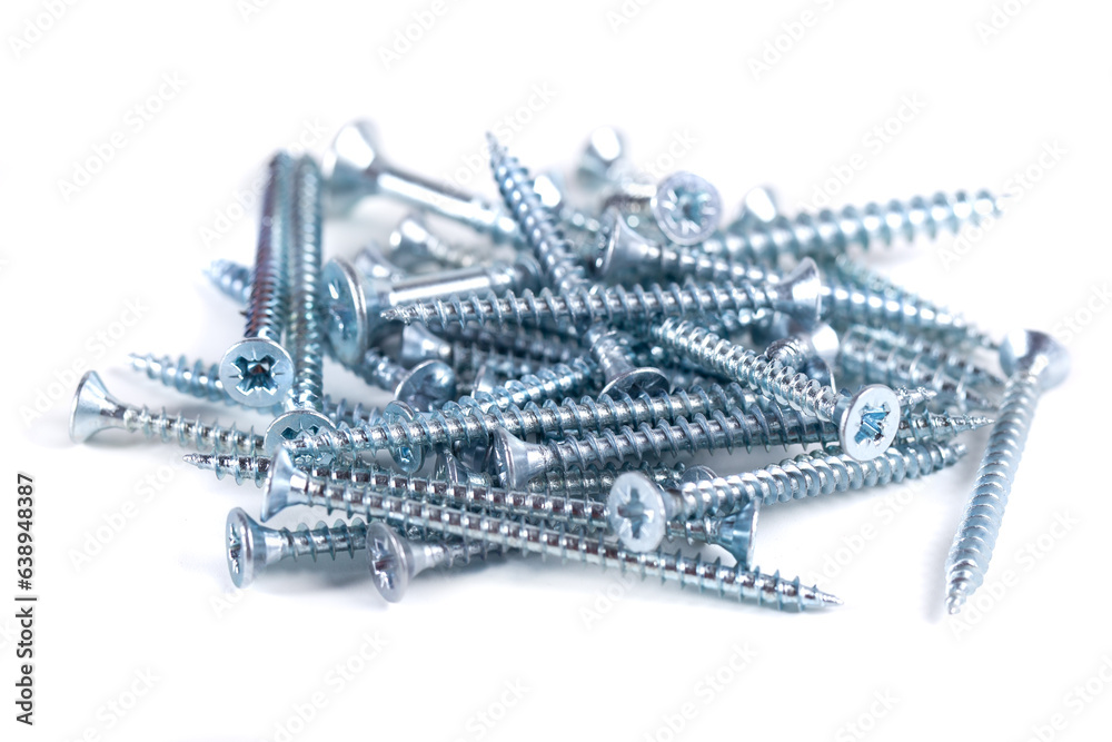 Chrome screw on white background. Tapping screws from steel close-up Chrome screw on white background. Tapping screws from steel close-up