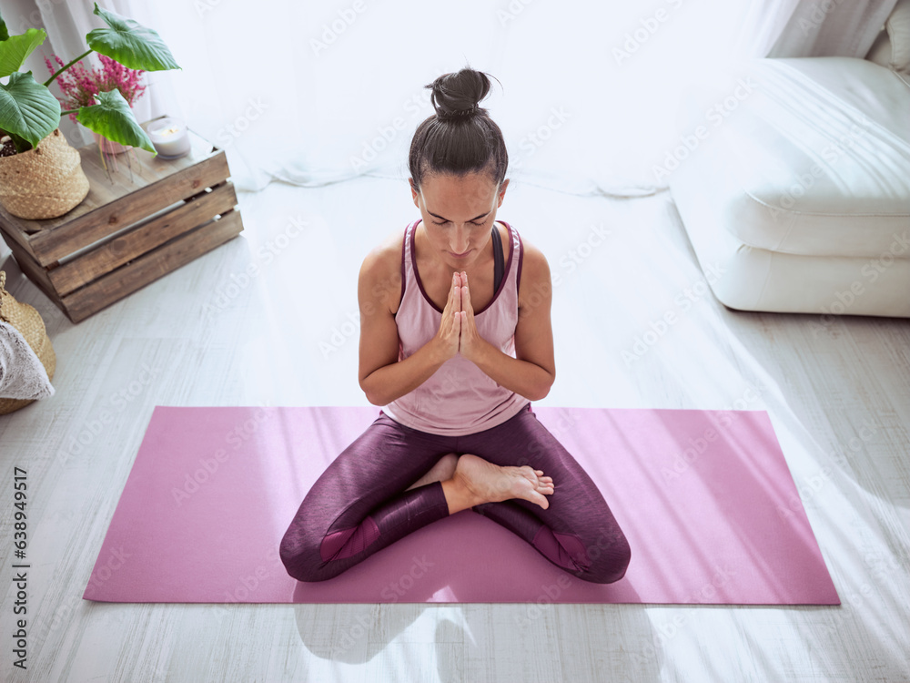 Woman meditating during yoga session