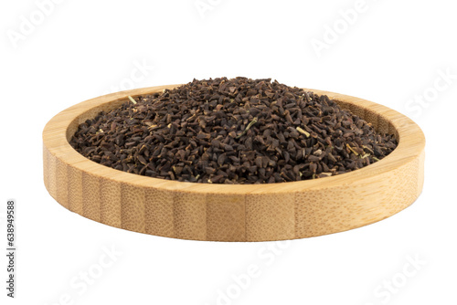 semen pegani in a wooden bowl