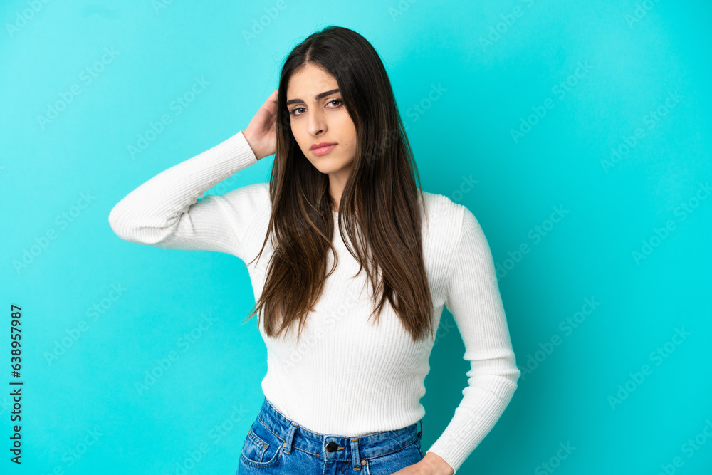 Young caucasian woman isolated on blue background having doubts Young caucasian woman isolated on blue background having doubts