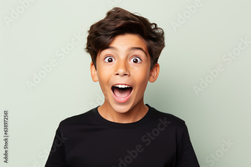 Surprise European Boy In Black Tank Top On Pastel Background. Сoncept Surprising European Boys, Black Tank Tops, Pastel Backgrounds, Summer Fashion Trends