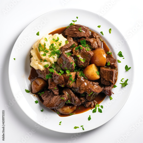 Beef And Guinness Irish Dish On A White Plate, On A White Background Directly Above View photo