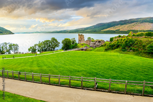 The ruins of medieval Urquhart Castle along the shores of Loch Ness lake in the Scottish Highlands near Inverness, Scotland, UK. photo