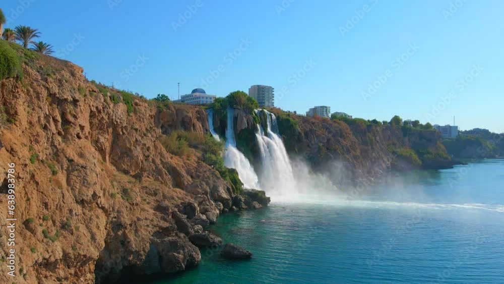 Slowmotion aerial video of the Lower Duden Waterfall in the city of Antalya. Drone moves straight towards the waterfall. Slowmotion aerial video of the Lower Duden Waterfall in the city of Antalya. Drone moves straight towards the waterfall.