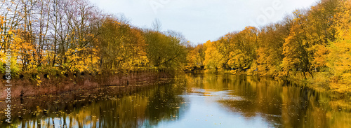 Autumn landscape with a lake surrounded by trees