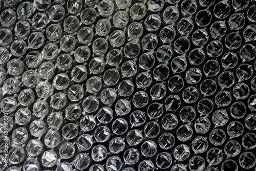 Black bubble plastic wrap surface. plastic with air balls on the surface used to pack glassware or electronics or sensitive items © Sanja