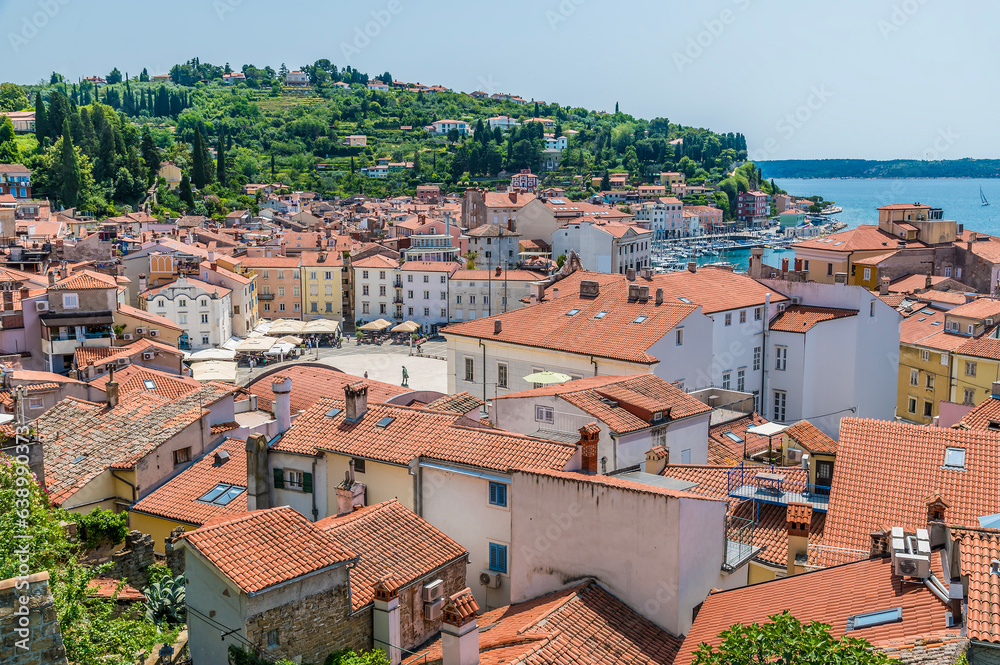 A view over the rooftops towards the Central Square and harbour from the cathedral above the town of Piran, Slovenia in summertime