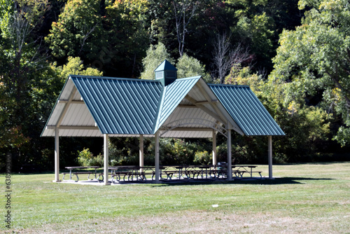 A metal roof gazebo in park.