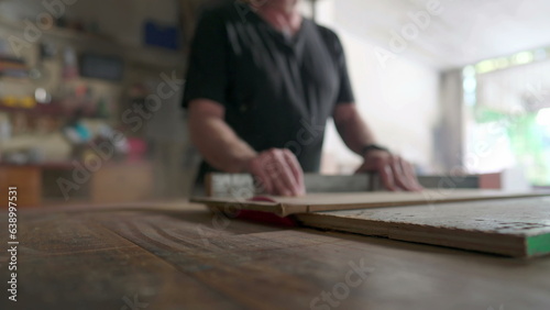 Master carpenter working in his woodwork or workshop