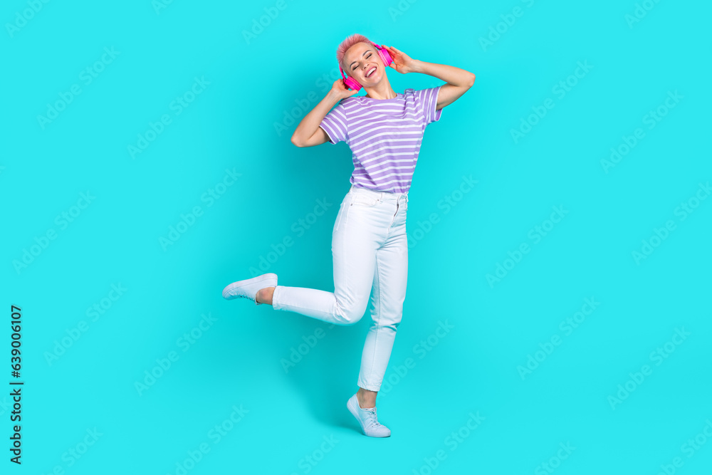 Full body photo cadre of careless young girl music playlist spotify app advertisement dance rhythm isolated on aquamarine color background