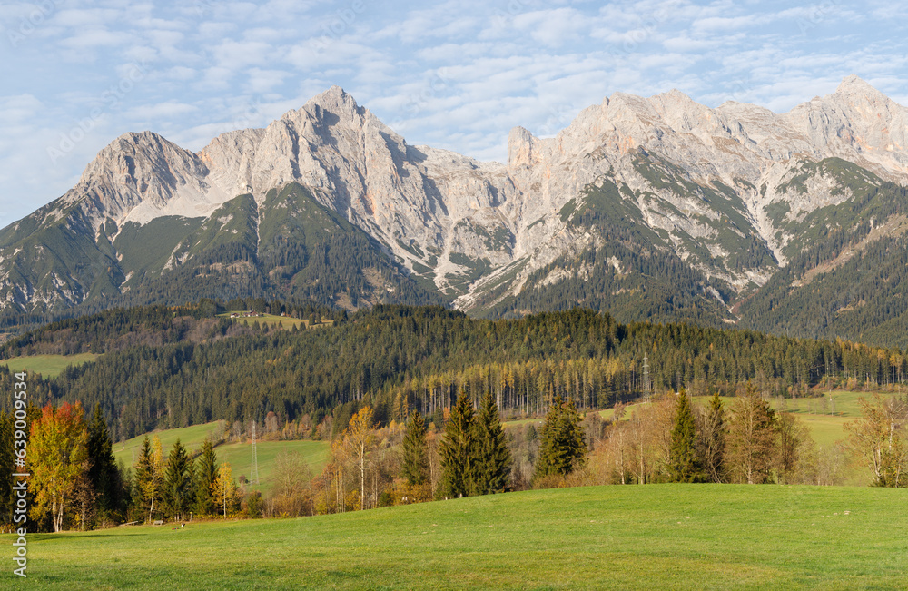 High mountains and colorful trees near Maria Alm village in Austrian Alps in Autumn