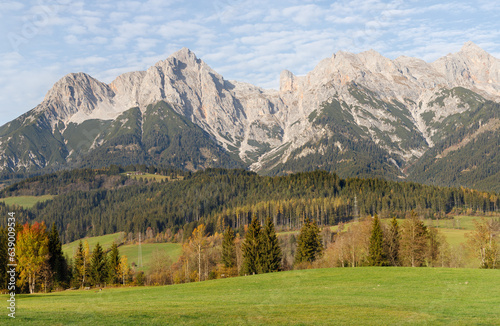 Fototapeta Naklejka Na Ścianę i Meble -  High mountains and colorful trees near Maria Alm village in Austrian Alps in Autumn