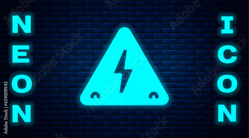 Glowing neon High voltage sign icon isolated on brick wall background. Danger symbol. Arrow in triangle. Warning icon. Vector