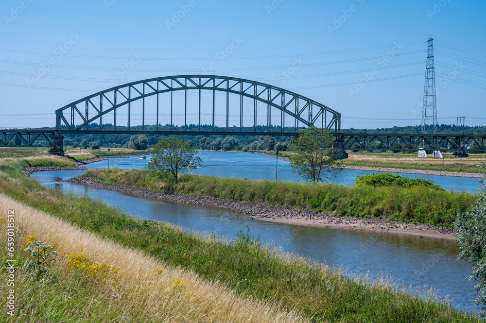 Colorfull heather over blue sk at the banks of the river Rhine around Arnhem, the Netherlands Colorfull heather over blue sk at the banks of the river Rhine around Arnhem, the Netherlands