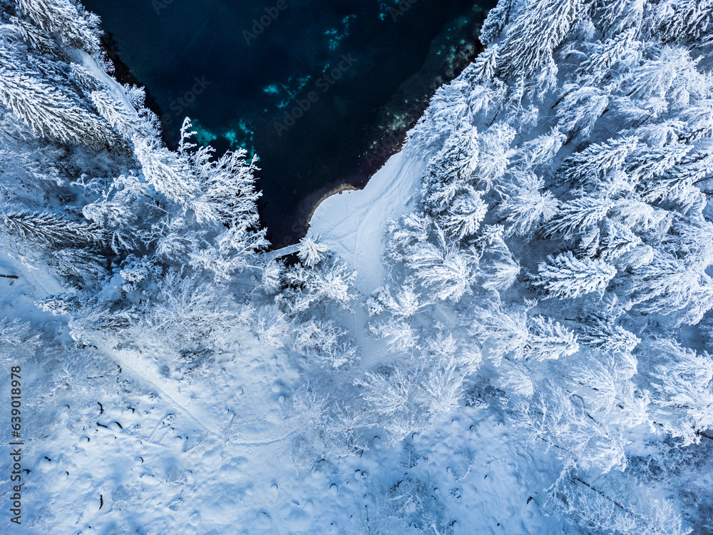 Magic and emotions of the Fusine lakes after the snowfall. Winter dress magic. Tarvisio. Top view Magic and emotions of the Fusine lakes after the snowfall. Winter dress magic. Tarvisio. Top view