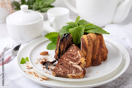 Chocolate biscuit dessert on a white dish on a white background