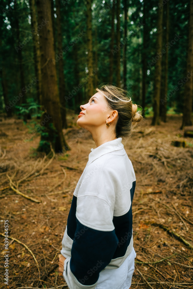 Portrait of attractive caucasian woman enjoying nature in a forest. Portrait of attractive caucasian woman enjoying nature in a forest.