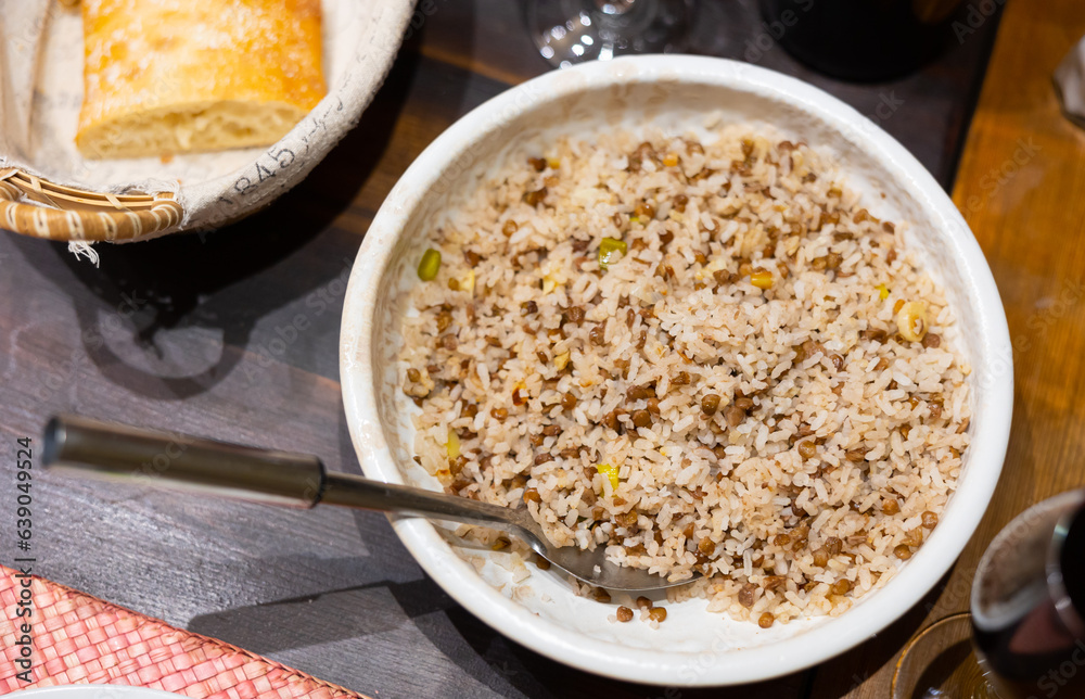 Popular hearty dish of Oriental cuisine is rice with lentils