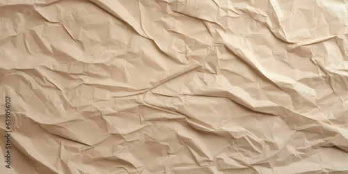 Background texture of crumpled craft paper, pattern with wrapping paper features wrinkles, waves and tears. 