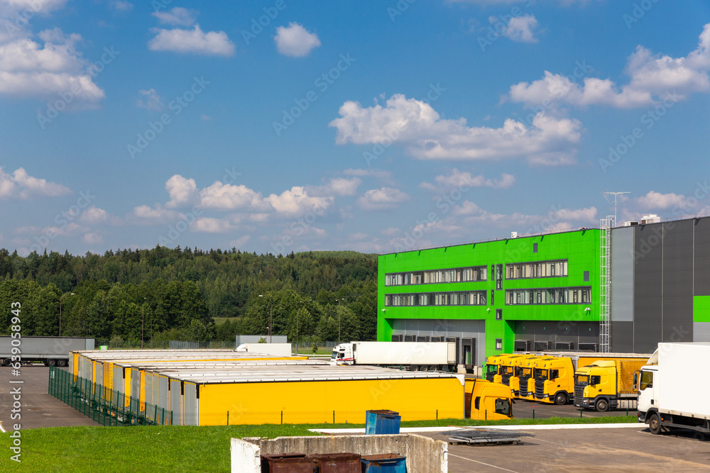 Distribution warehouse with trucks of different capacity.