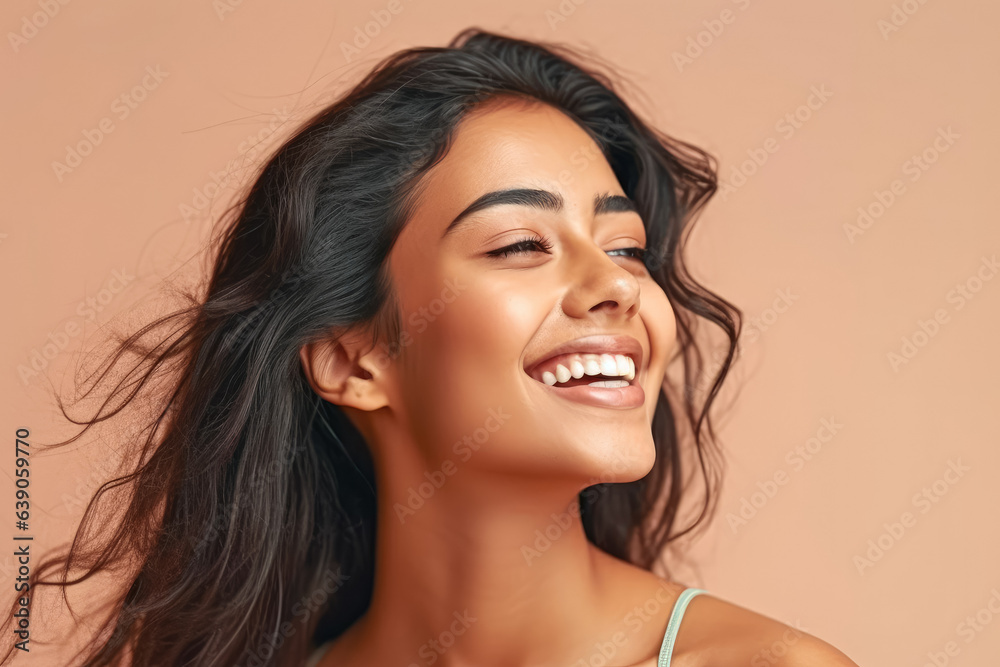 A stunning Indian woman smiling at the camera against a pastel background. Generative AI, AI. A stunning Indian woman smiling at the camera against a pastel background. Generative AI, AI.