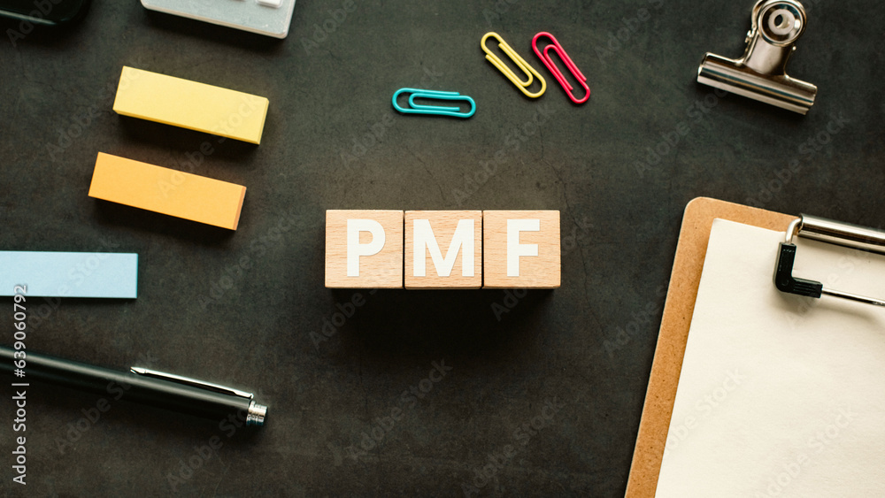 There is wood cube with the word PMF. It is an abbreviation for Product Market Fit as eye-catching image. There is wood cube with the word PMF. It is an abbreviation for Product Market Fit as eye-catching image.