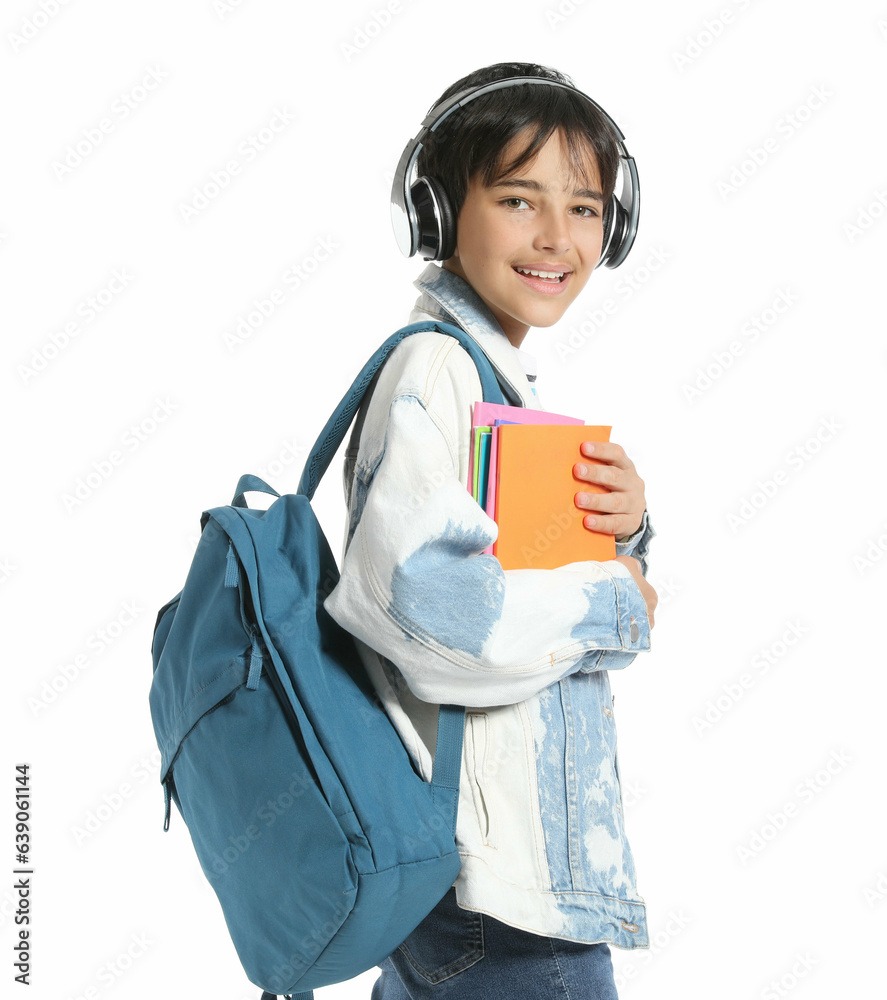 Little boy in headphones with copybooks on white background Little boy in headphones with copybooks on white background