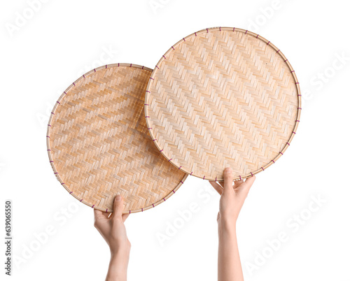 Female hands holding wicker...