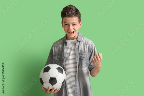 Happy little boy with socce...