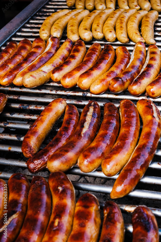 Grilled German sausages, golden on the fire.