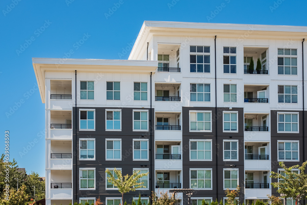 Fototapeta premium Brand new apartment building on summer. Canadian modern residential architecture. Modern complex of apartment buildings