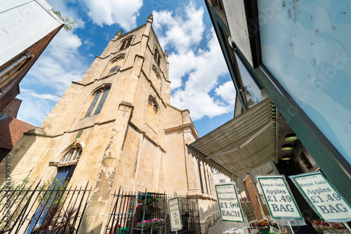 St Swithun's historic, grade 1 listed Anglican church,opposite crocer's shop,along a narrow street,Worcster city center,Worcestershire,England,U.K. photo