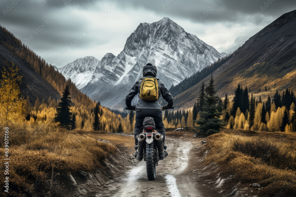 Male biker on motorcycle rides off-road in mountains in highlands, beautiful mountain landscape, clouds sky, autumn season. Active leisure, travel, sport concept. Generative ai .