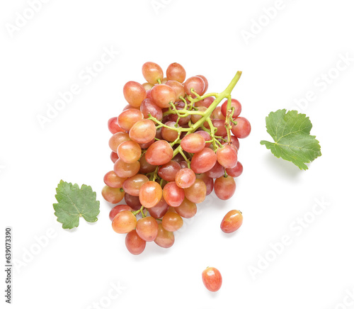 Tasty ripe grapes and leaves on white background