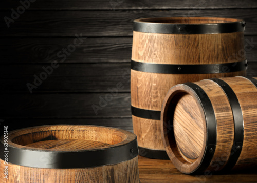 Barrels on wooden background, space for text
