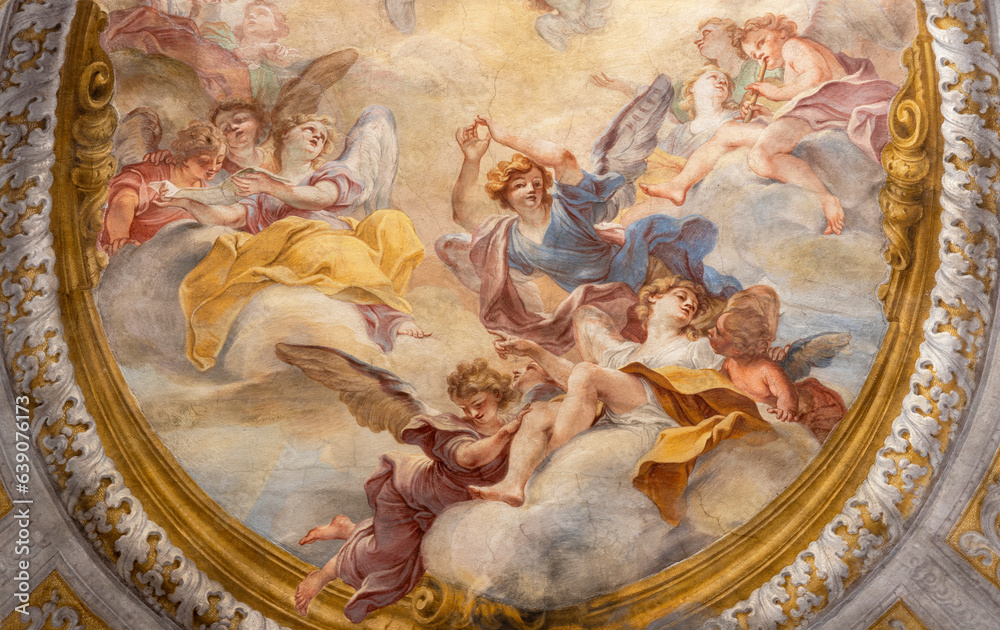 GENOVA, ITALY - MARCH 8, 2023:  The angels in the glory - fresco in the side chapel of church Chiesa di san Filippo Neri by  Marcantonio Franceschini (1648 – 1729).
