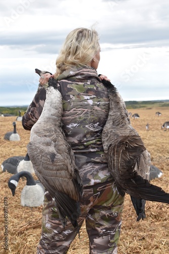 Woman Hunting Water Fowl Ducks Geese in Canada with Camo On