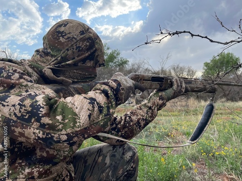 Man Hunter Hunting with Camouflage and Shotgun
