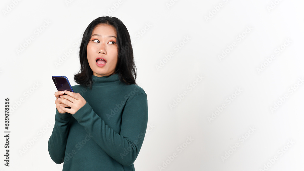 Fototapeta premium Holding Smartphone and looking side Of Beautiful Asian Woman Isolated On White Background