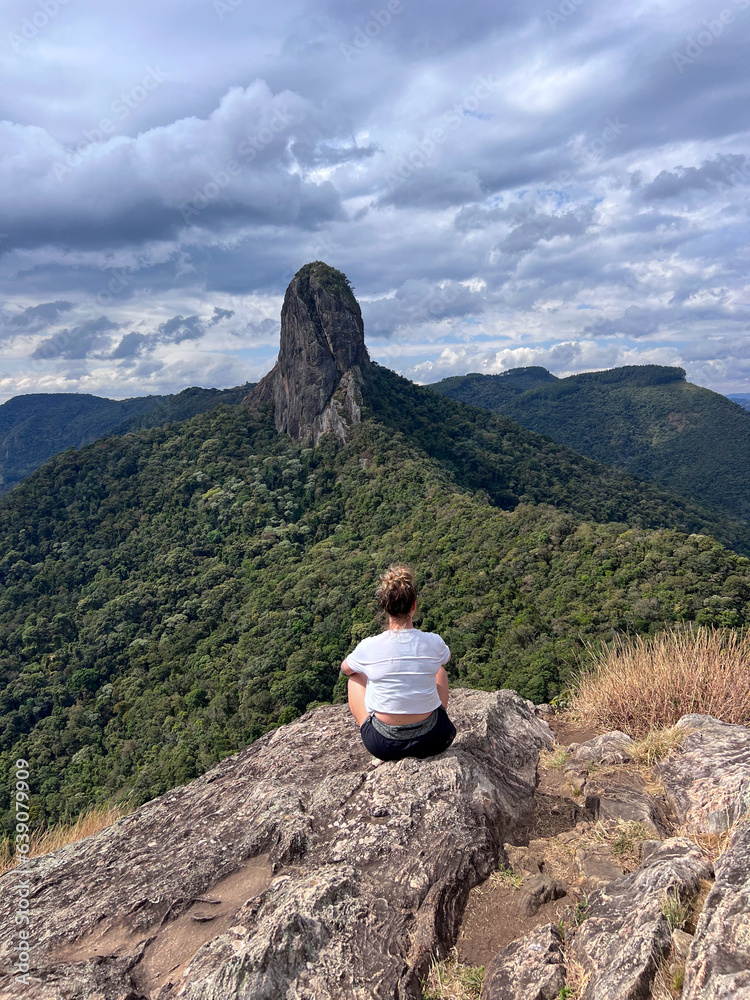 Woman on the Ana Chata trail in São Bento do Sapucaí overlooking Pedra do Bau.