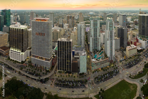 Aerial view of heavy traffic on urban street in downtown office district of Miami Brickell in Florida, USA. High commercial and residential skyscraper buildings in modern american megapolis